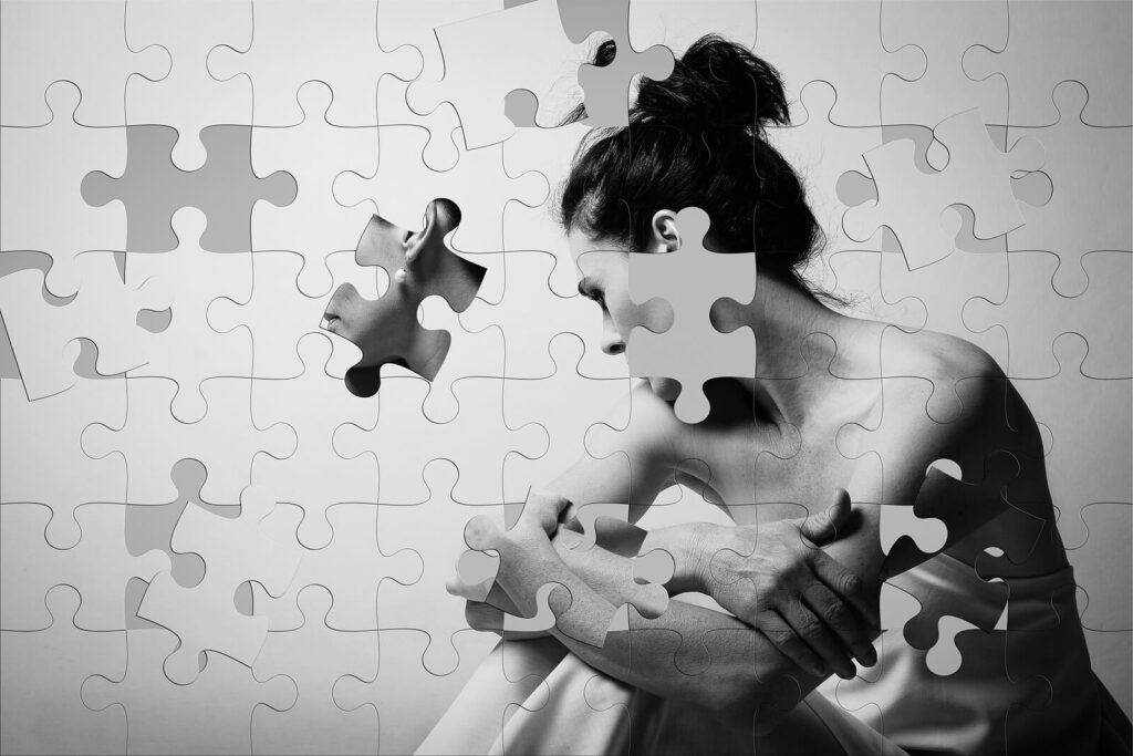 Picture of a woman broken into puzzle pieces representing the fragmentation of dissociative disorders. Dissociative Disorder can be overcome with help from a trauma therapist in Pasadena, CA. Learn more here.
